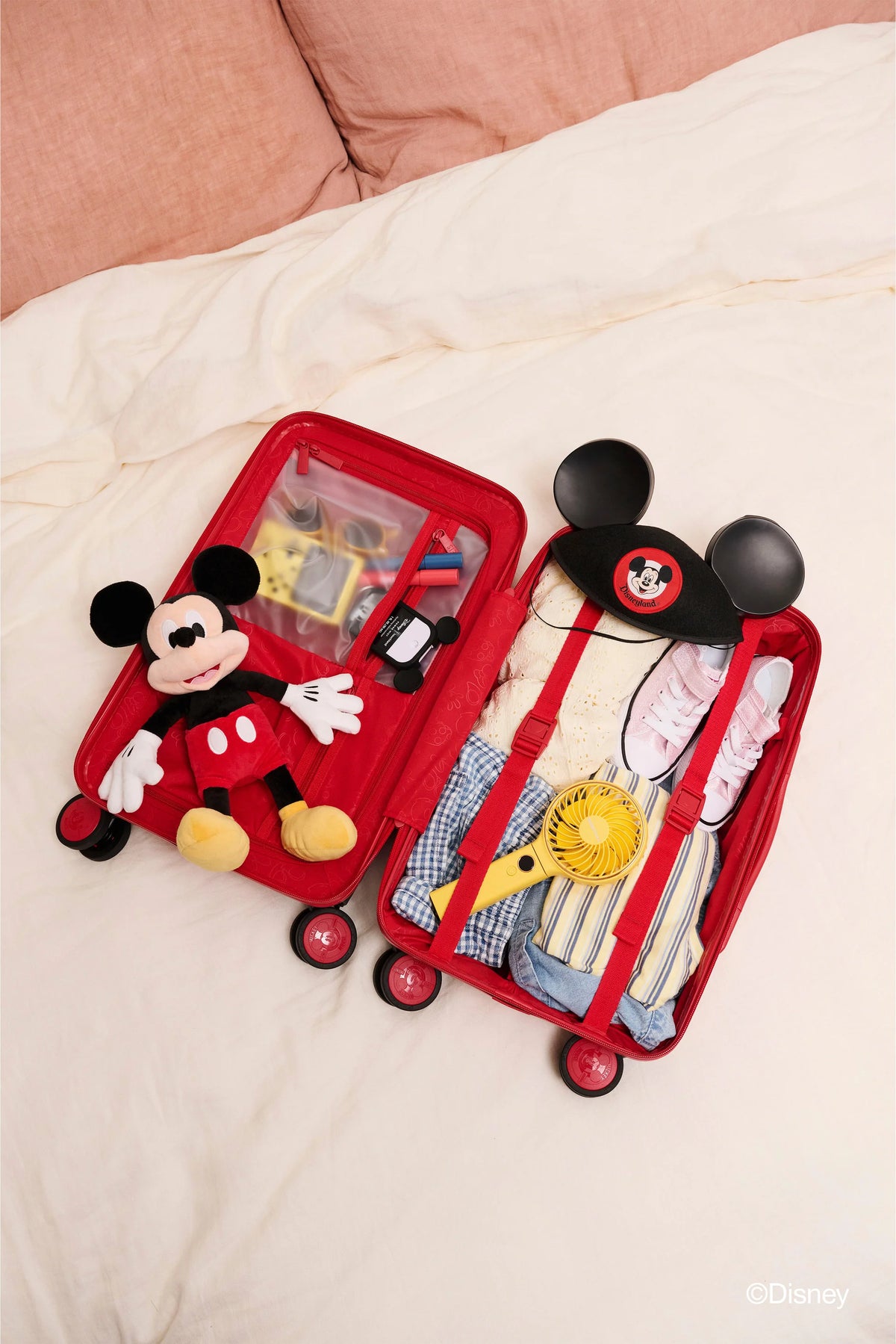 The Disney Small Carry-On Roller  in Mickey Mouse Red